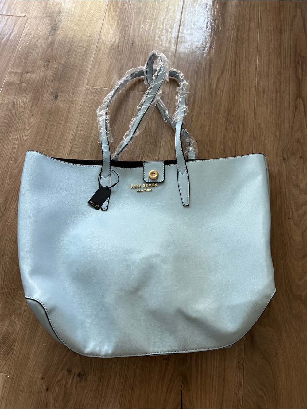 kate spade pale blue leather tote with gold logo